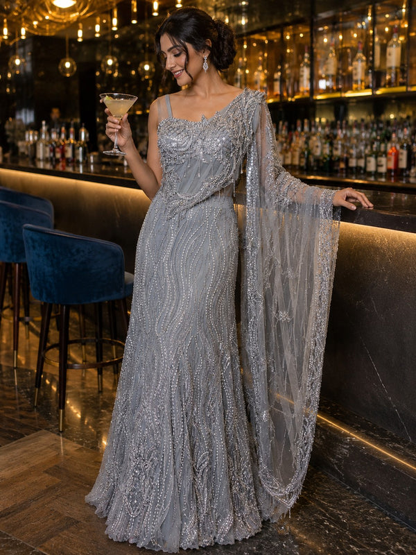 Silver-grey sequinned pre-draped saree gown with embellished shoulder pallu